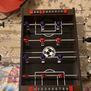 Compact Tabletop Foosball Game with Red and Blue Players